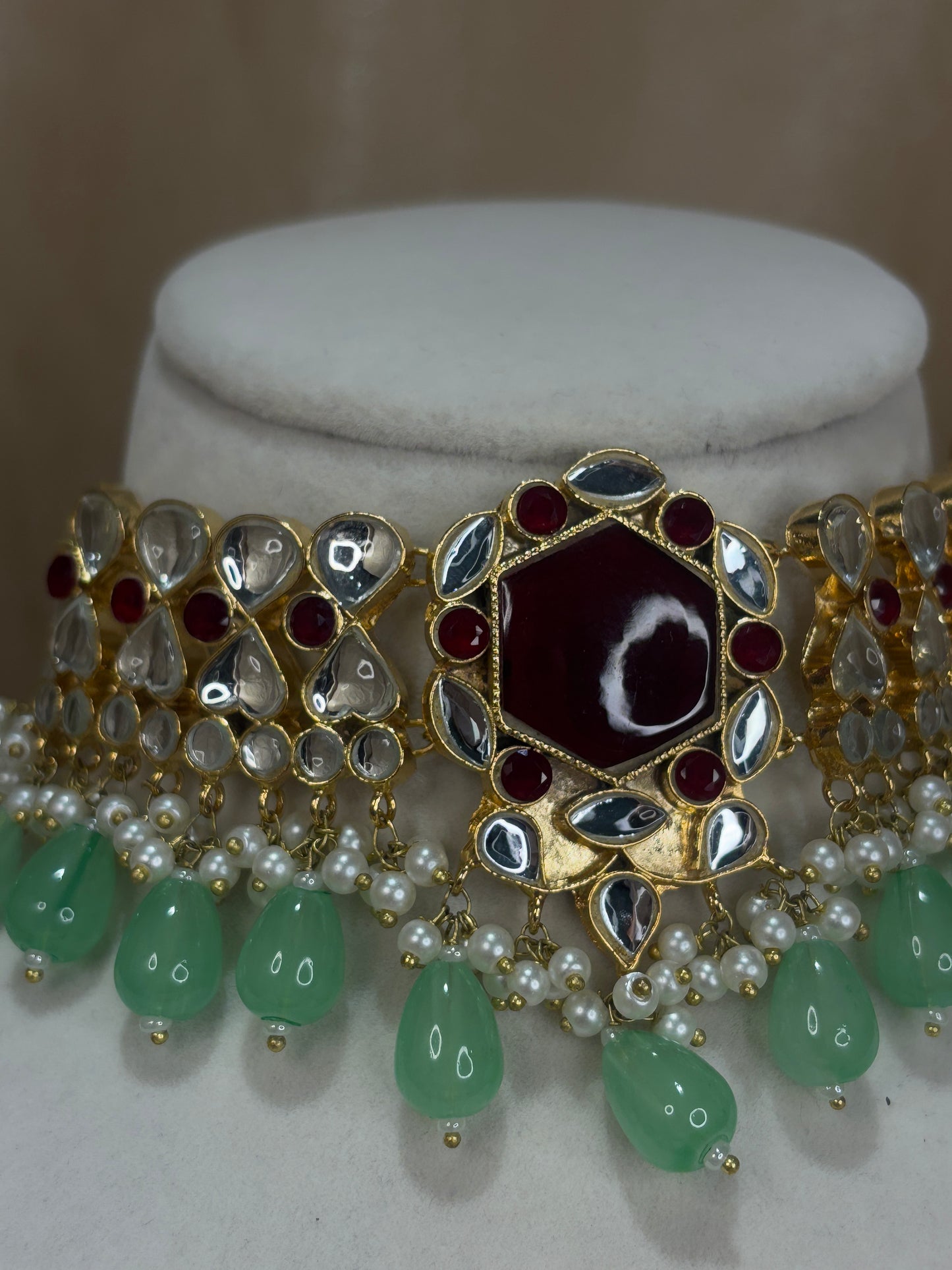 Maroon and mint green Farshi kundan set