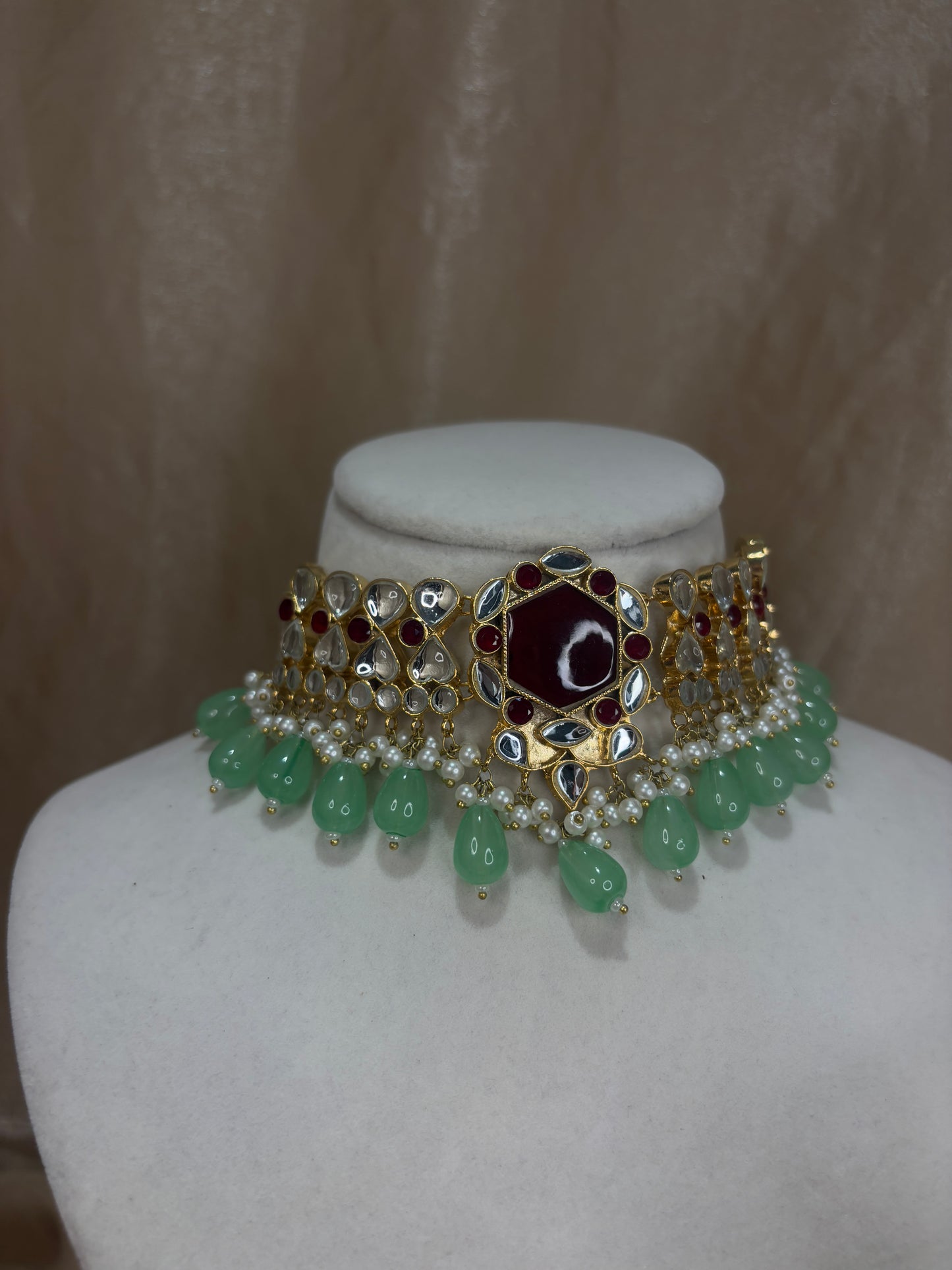 Maroon and mint green Farshi kundan set