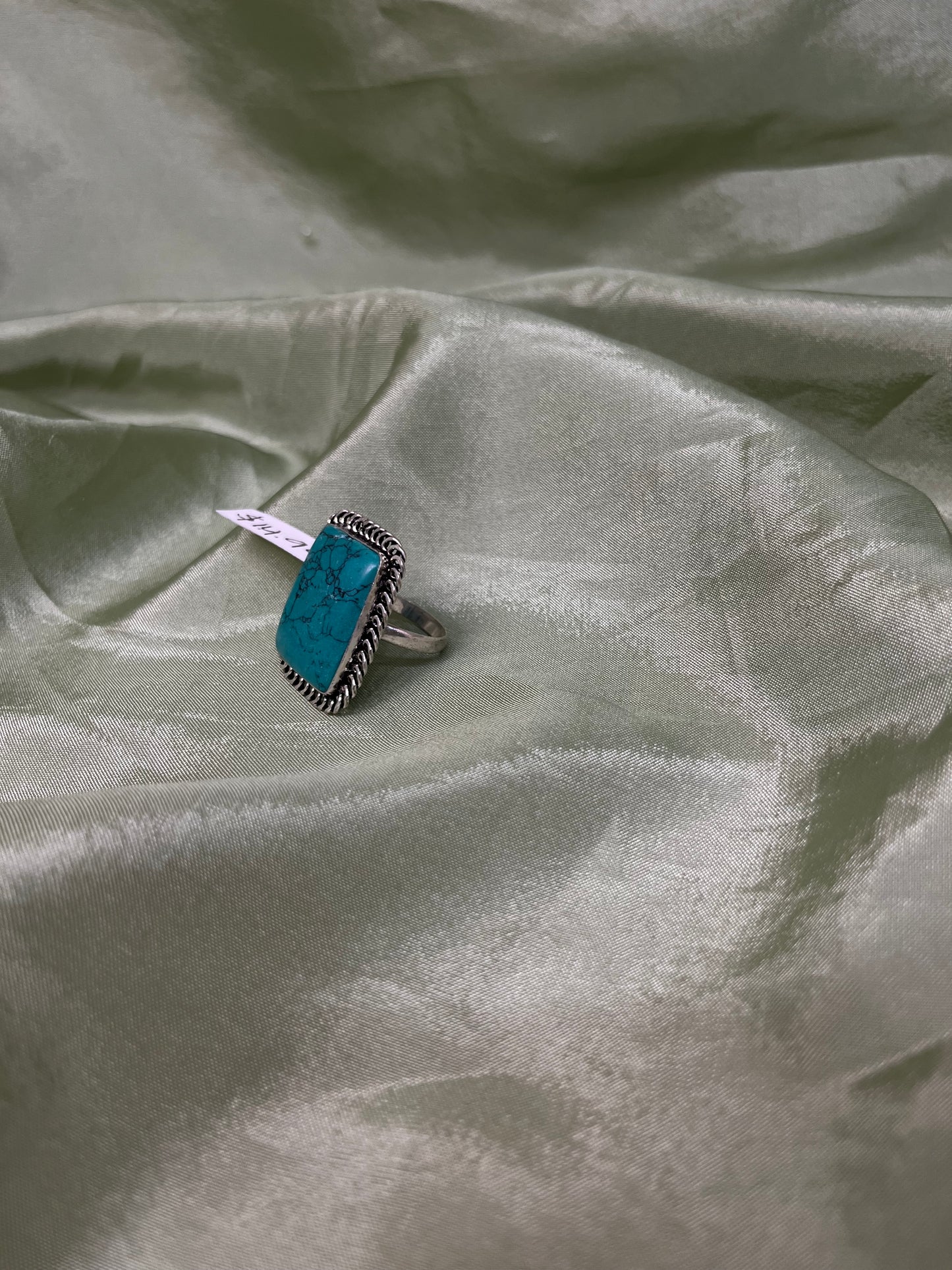 Teal oxidized ring